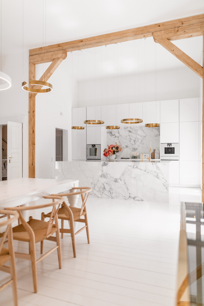 Large trendy galley white floor eat-in kitchen photo in Cologne with an integrated sink, flat-panel cabinets, white cabinets, marble countertops, white backsplash, ceramic backsplash, white appliances, an island and white countertops