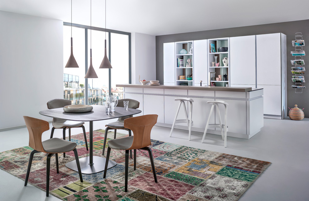 Large modern kitchen/diner in Stuttgart with open cabinets, white cabinets and an island.