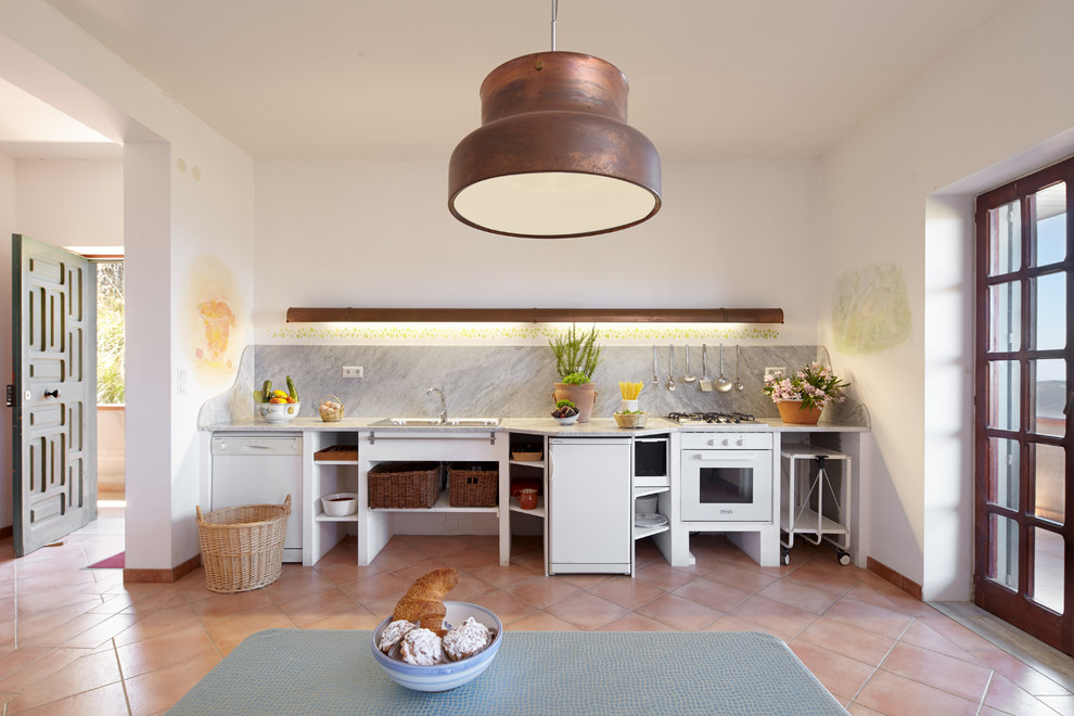 This is an example of a large mediterranean single-wall kitchen/diner in Naples with open cabinets, white cabinets, grey splashback, white appliances, terracotta flooring, no island and orange floors.