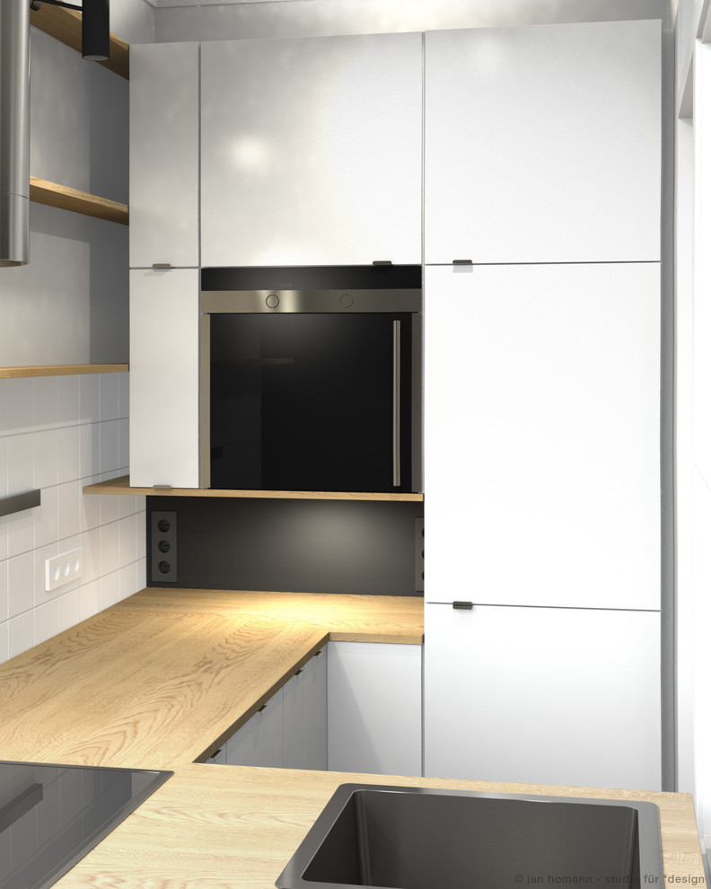 Design ideas for a small contemporary u-shaped enclosed kitchen in Hamburg with a built-in sink, flat-panel cabinets, white cabinets, wood worktops, white splashback, ceramic splashback, stainless steel appliances, ceramic flooring and no island.