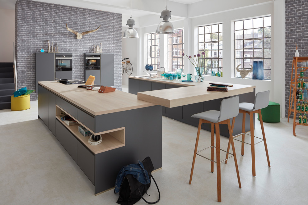 Inspiration for a large contemporary u-shaped kitchen remodel in Dusseldorf with gray cabinets, multicolored backsplash and brick backsplash