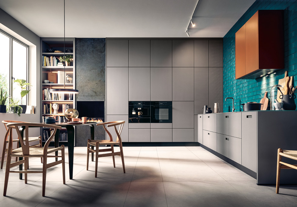 This is an example of a large contemporary l-shaped kitchen/diner in Nuremberg with glass-front cabinets, grey cabinets, glass worktops, black appliances, no island, grey floors and grey worktops.