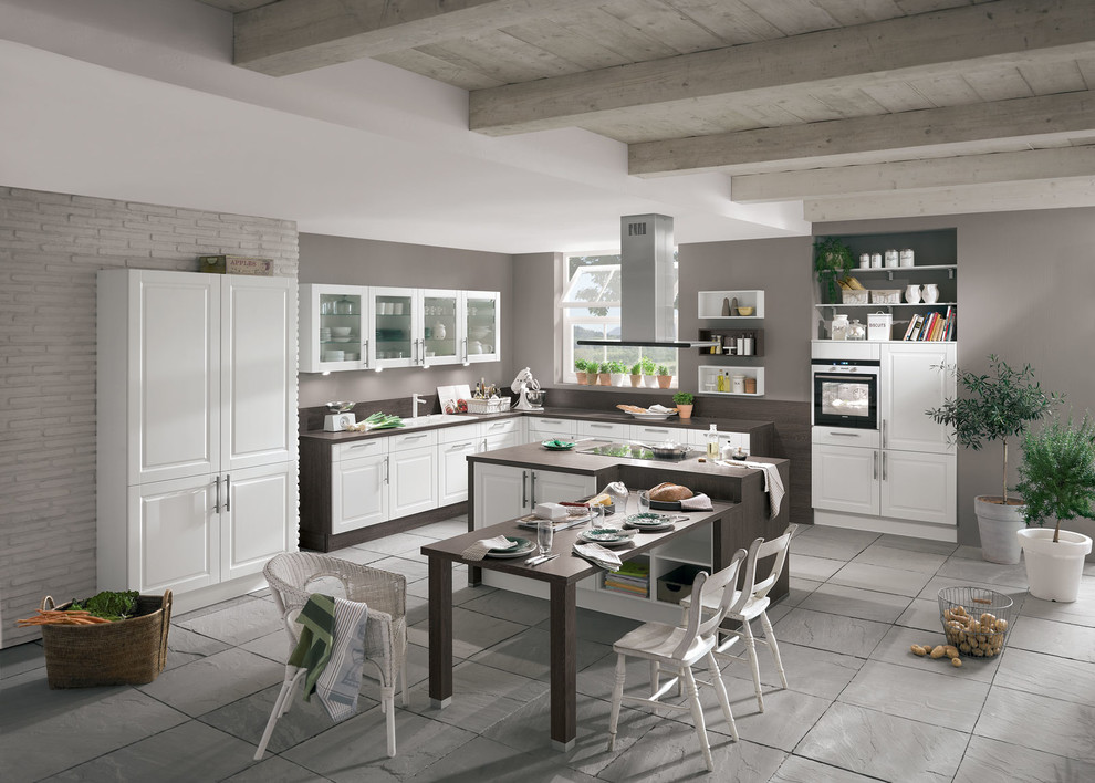 Design ideas for a large farmhouse kitchen in Berlin with white cabinets, wood worktops and an island.