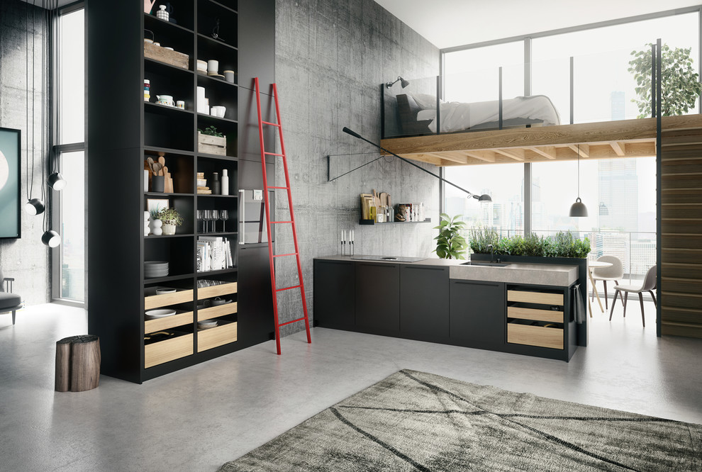 Foto di una grande cucina minimal con ante lisce, elettrodomestici neri, top in superficie solida e pavimento in cemento
