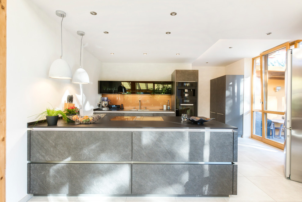 Inspiration for a contemporary kitchen in Nuremberg with grey cabinets.