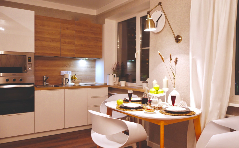 Small danish l-shaped kitchen photo in Saint Petersburg with flat-panel cabinets