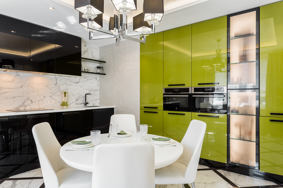 Example of a large trendy l-shaped porcelain tile and white floor eat-in kitchen design in Other with an undermount sink, green cabinets, solid surface countertops, white backsplash, ceramic backsplash, black appliances, no island, white countertops and flat-panel cabinets