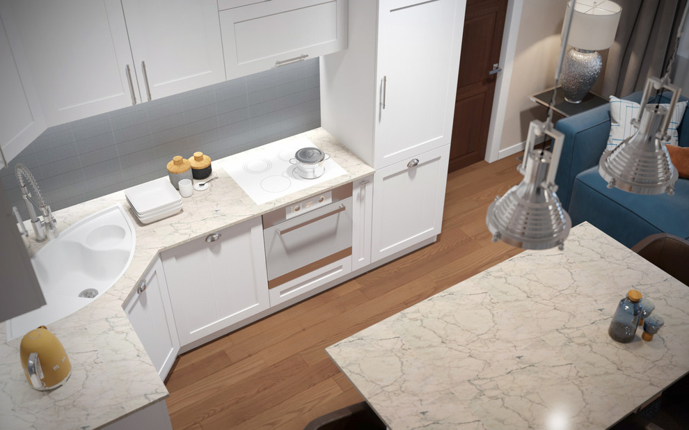 Small scandinavian l-shaped kitchen/diner in Other with a built-in sink, raised-panel cabinets, white cabinets, composite countertops, grey splashback, ceramic splashback, white appliances, laminate floors, an island, brown floors and beige worktops.