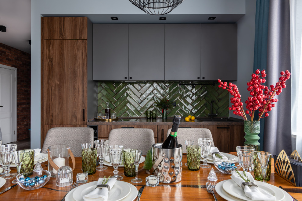 Photo of a medium sized contemporary single-wall kitchen/diner in Moscow with a submerged sink, flat-panel cabinets, dark wood cabinets, laminate countertops, green splashback, ceramic splashback, black appliances, porcelain flooring, no island, grey floors and brown worktops.