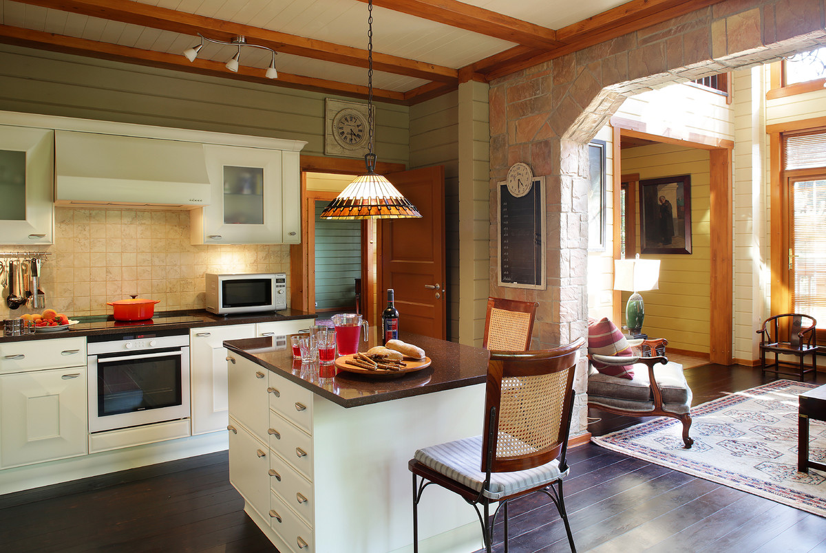 Open concept kitchen - large cottage l-shaped dark wood floor and brown floor open concept kitchen idea in Moscow with raised-panel cabinets, white cabinets, quartzite countertops, beige backsplash, ceramic backsplash, an island and white appliances
