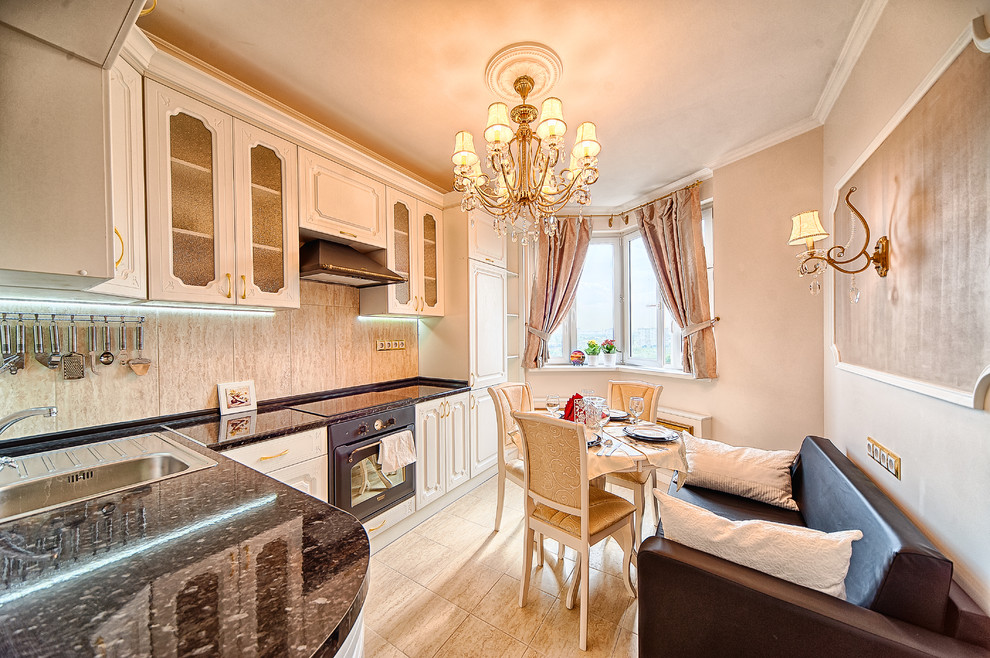 Enclosed kitchen - traditional l-shaped ceramic tile enclosed kitchen idea in Moscow with a single-bowl sink, white cabinets, solid surface countertops, ceramic backsplash, black appliances, no island, raised-panel cabinets and beige backsplash