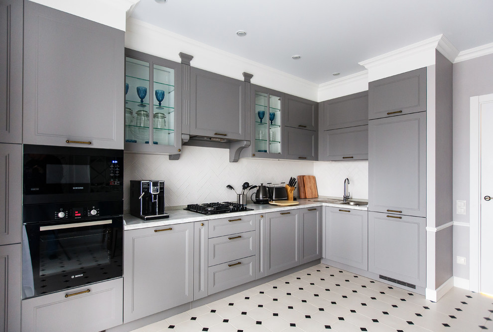 Photo of a traditional kitchen in Other with a built-in sink, recessed-panel cabinets, grey cabinets, white splashback, integrated appliances, no island, white floors and white worktops.