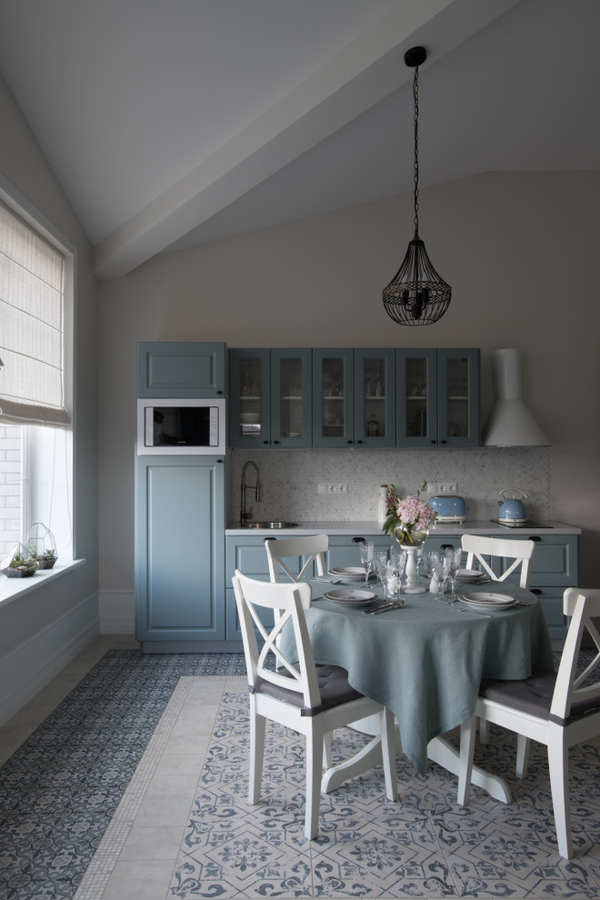 Photo of a large classic single-wall kitchen/diner in Moscow with a single-bowl sink, glass-front cabinets, turquoise cabinets, composite countertops, grey splashback, mosaic tiled splashback, stainless steel appliances, ceramic flooring, no island, grey floors, white worktops and a vaulted ceiling.
