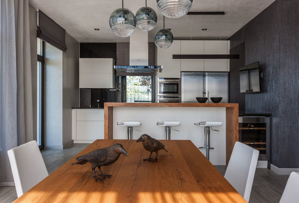 Inspiration for a contemporary single-wall gray floor eat-in kitchen remodel in Moscow with flat-panel cabinets, white cabinets, gray backsplash and an island