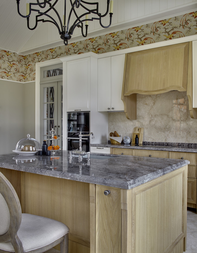 Example of a classic eat-in kitchen design in Moscow with an undermount sink, light wood cabinets and an island