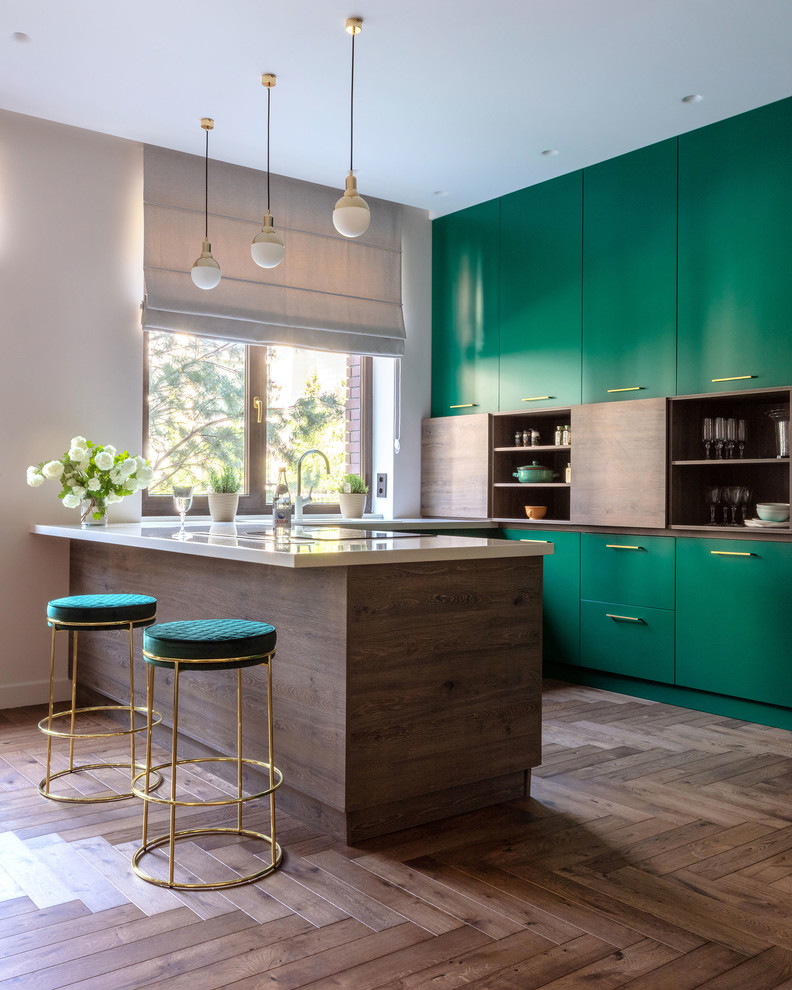 Contemporary u-shaped kitchen in Other with flat-panel cabinets, green cabinets, dark hardwood flooring, a breakfast bar, brown floors and white worktops.