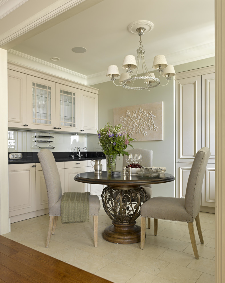 Inspiration for a small traditional galley kitchen/diner in Moscow with raised-panel cabinets, beige cabinets, engineered stone countertops, beige splashback, glass sheet splashback, stainless steel appliances, porcelain flooring and no island.