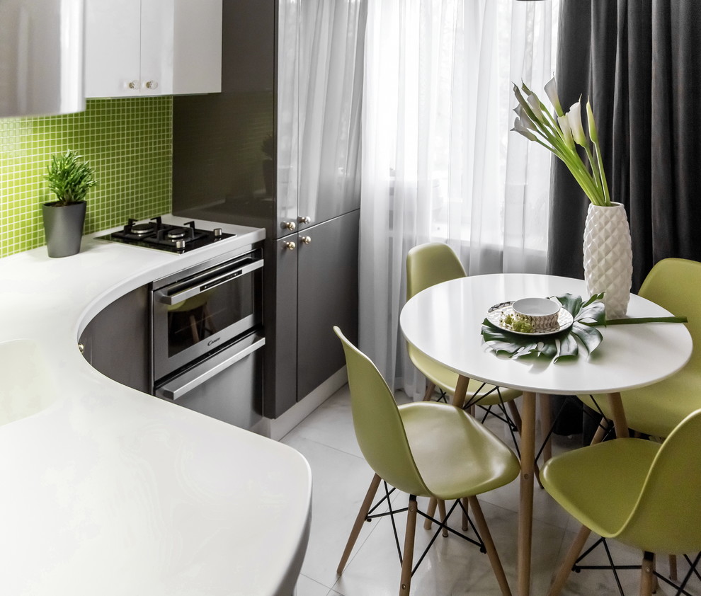 Inspiration for a small scandi l-shaped kitchen/diner in Moscow with flat-panel cabinets, grey cabinets, composite countertops, green splashback, mosaic tiled splashback, stainless steel appliances, no island, an integrated sink and marble flooring.