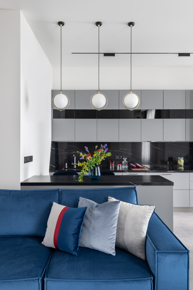 Immagine di una grande cucina design con pavimento in laminato e pavimento grigio