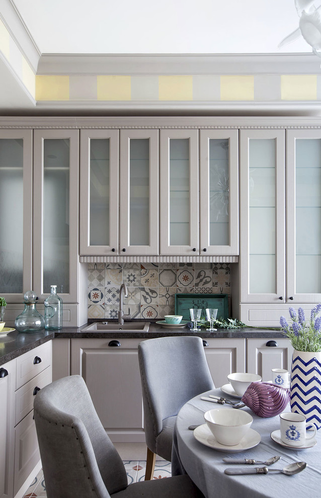 Example of a transitional kitchen design in Other with a drop-in sink, recessed-panel cabinets, gray cabinets and multicolored backsplash