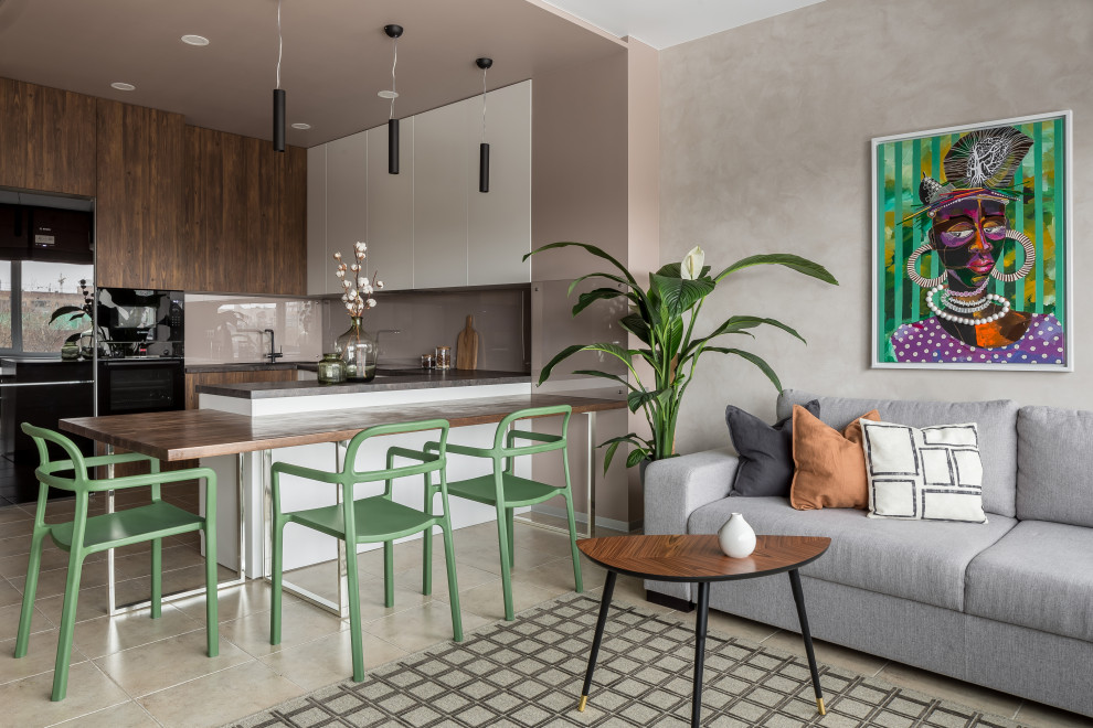 Small trendy u-shaped porcelain tile, beige floor and tray ceiling open concept kitchen photo in Other with a drop-in sink, flat-panel cabinets, white cabinets, laminate countertops, beige backsplash, glass tile backsplash, black appliances, a peninsula and black countertops