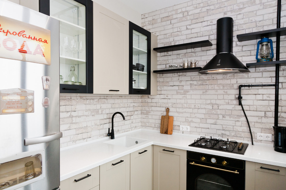 Design ideas for a small urban l-shaped enclosed kitchen in Moscow with no island.