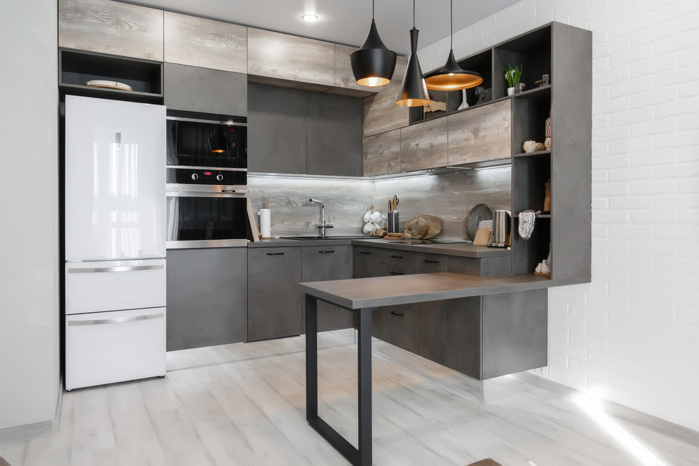 This is an example of a small industrial l-shaped enclosed kitchen in Moscow with a built-in sink, flat-panel cabinets, grey cabinets, composite countertops, wood splashback, laminate floors, grey floors, grey worktops, grey splashback, white appliances and a breakfast bar.