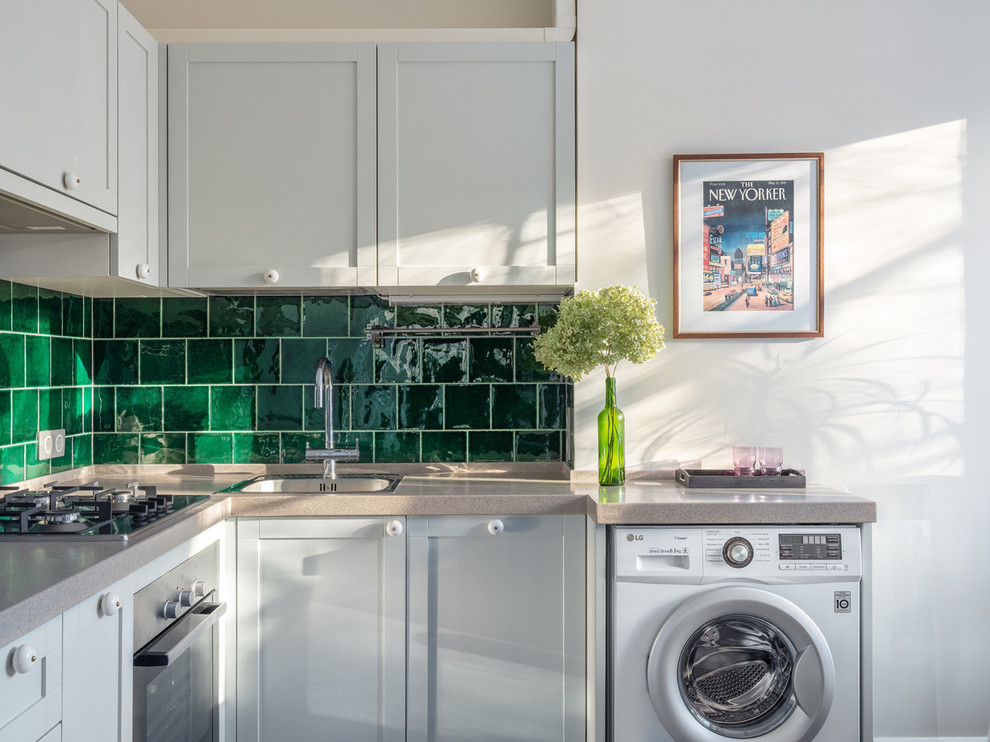Photo of a small retro l-shaped kitchen/diner in Moscow with a single-bowl sink, recessed-panel cabinets, grey cabinets, engineered stone countertops, green splashback, ceramic splashback, no island and beige worktops.