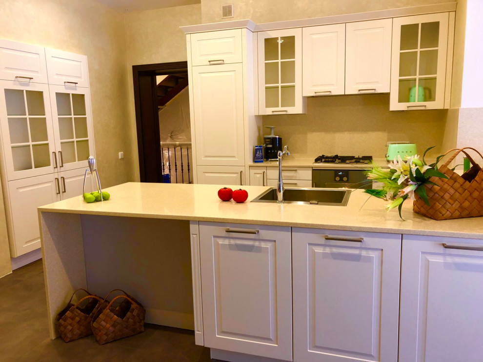 Photo of a classic kitchen in Other with a breakfast bar.