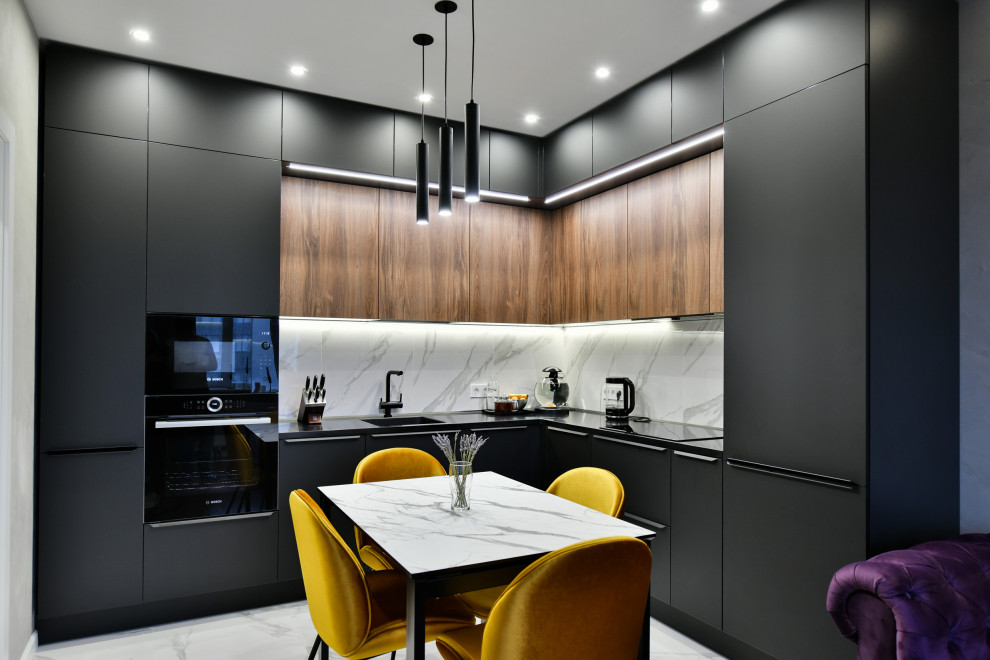 Inspiration for a medium sized contemporary l-shaped kitchen/diner in Saint Petersburg with an integrated sink, flat-panel cabinets, black cabinets, integrated appliances, no island, grey floors and black worktops.