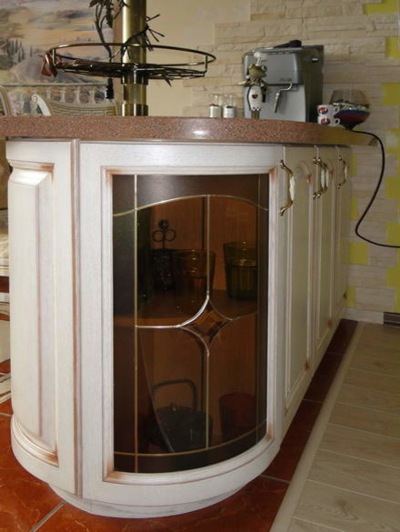 Design ideas for a medium sized classic l-shaped kitchen/diner in Moscow with a submerged sink, raised-panel cabinets, light wood cabinets, composite countertops, beige splashback, ceramic splashback, white appliances, ceramic flooring, an island, multi-coloured floors and brown worktops.