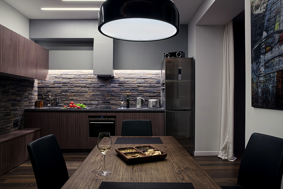 Small trendy u-shaped dark wood floor open concept kitchen photo in Moscow with an integrated sink, flat-panel cabinets, medium tone wood cabinets, solid surface countertops, gray backsplash, porcelain backsplash, stainless steel appliances and no island