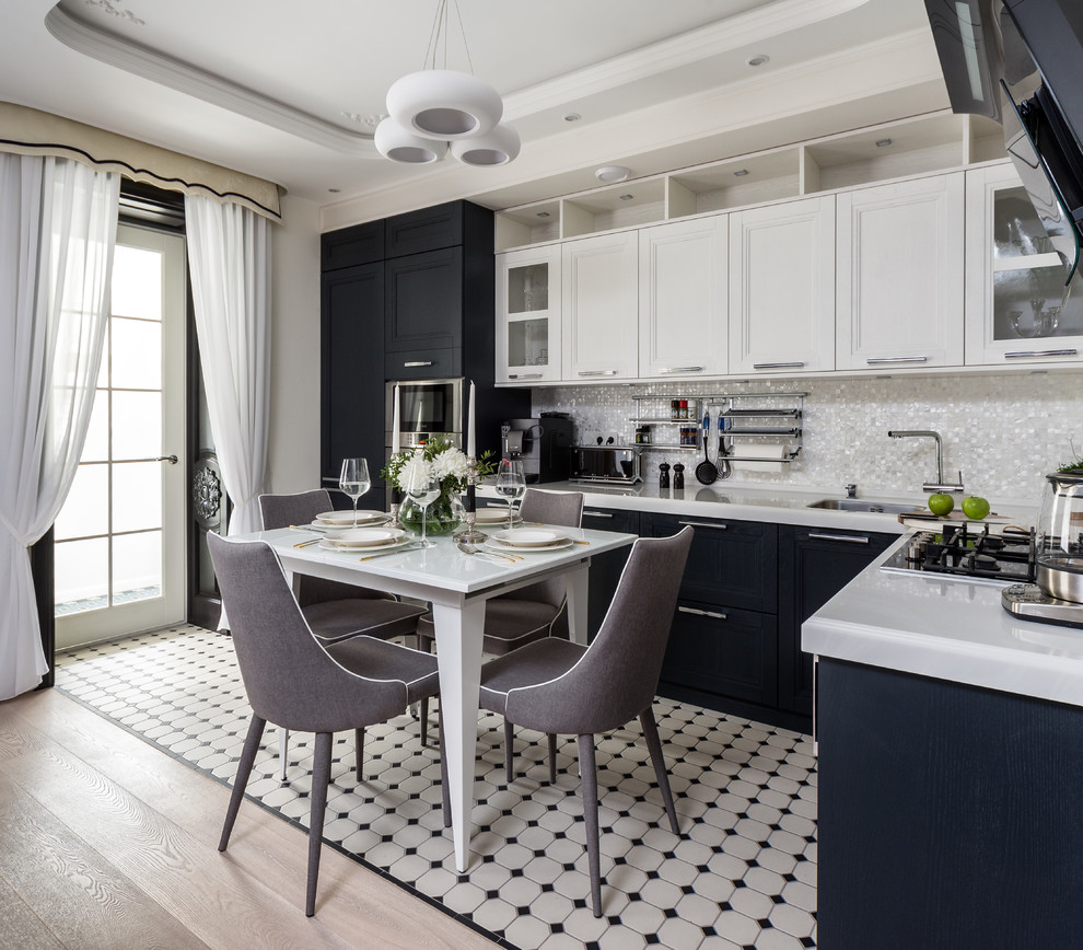 Example of a transitional l-shaped multicolored floor open concept kitchen design in Moscow with a drop-in sink, recessed-panel cabinets, white backsplash, mosaic tile backsplash, stainless steel appliances and no island