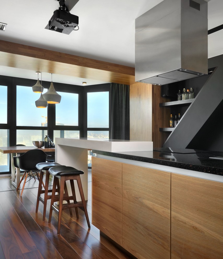 Свежая идея для дизайна: кухня-гостиная в современном стиле с плоскими фасадами и островом - отличное фото интерьера