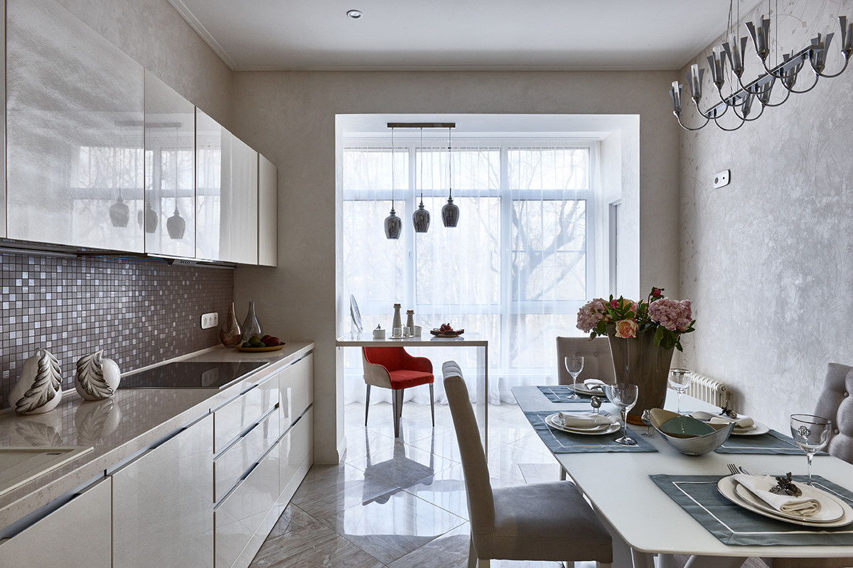 Example of a trendy l-shaped eat-in kitchen design in Moscow with flat-panel cabinets, beige cabinets, gray backsplash, mosaic tile backsplash and no island