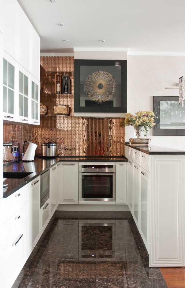 Inspiration for a transitional u-shaped open concept kitchen remodel in Moscow with white cabinets, metallic backsplash, stainless steel appliances and a peninsula