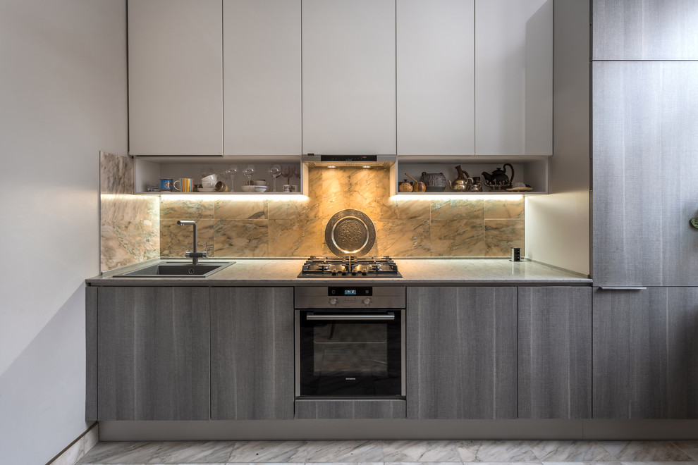 Inspiration for a small contemporary single-wall marble floor and white floor enclosed kitchen remodel in Moscow with a drop-in sink, flat-panel cabinets, gray cabinets, quartz countertops, stone tile backsplash, stainless steel appliances and no island