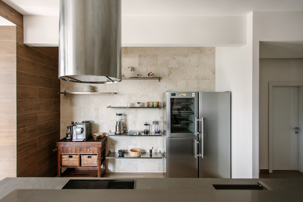 Photo of a small industrial single-wall open plan kitchen in Moscow with a submerged sink, engineered stone countertops, grey splashback, stone slab splashback, stainless steel appliances, ceramic flooring, an island and brown floors.