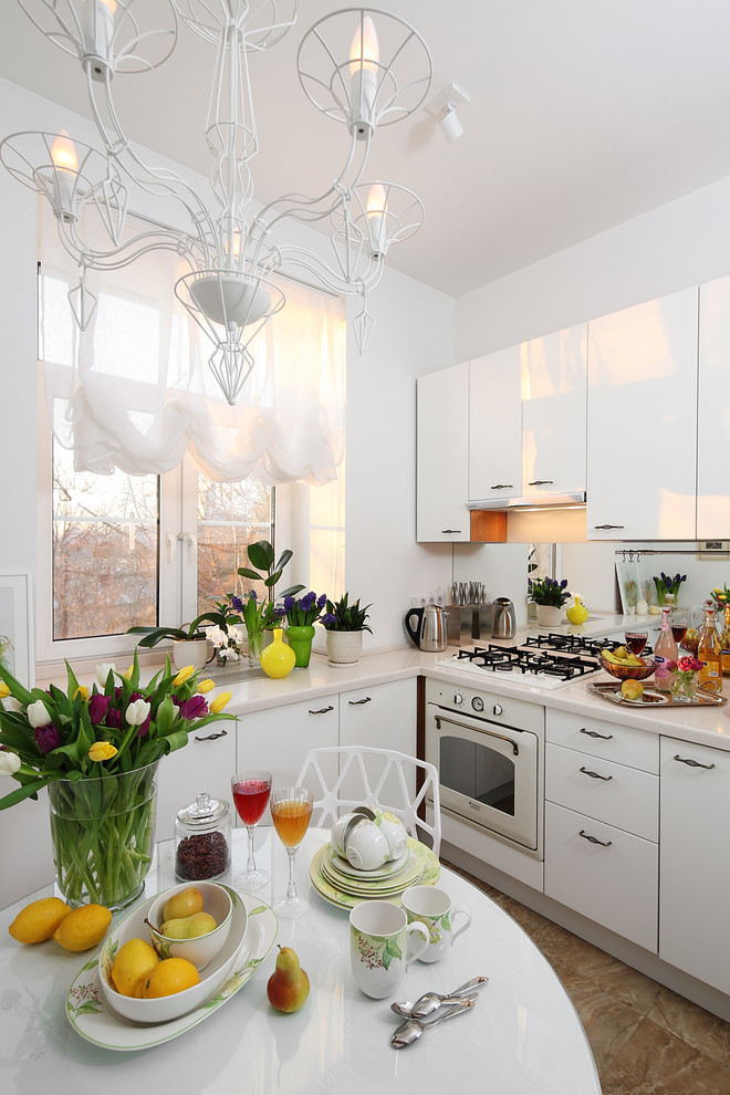 Example of a trendy single-wall brown floor enclosed kitchen design in Moscow with flat-panel cabinets, white cabinets, white backsplash, glass sheet backsplash, white appliances, no island and an integrated sink