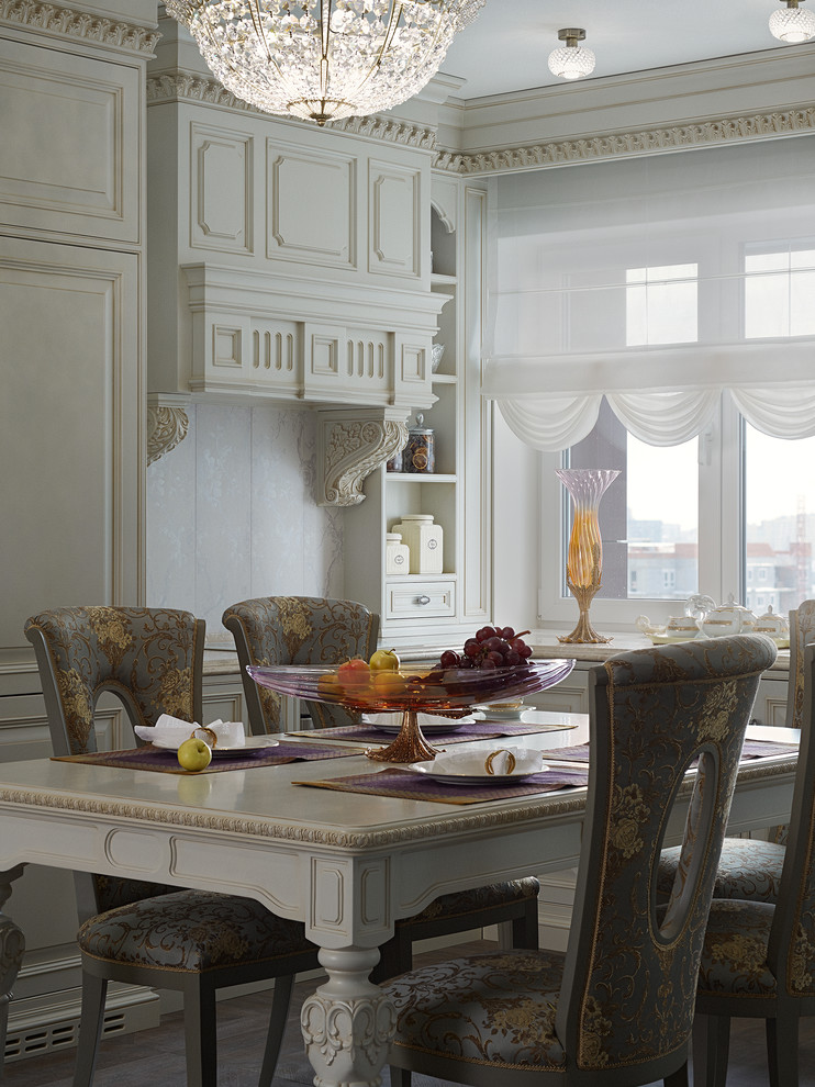 Стильный дизайн: угловая кухня среднего размера в классическом стиле с обеденным столом, полом из керамогранита, фасадами с выступающей филенкой и белыми фасадами без острова - последний тренд