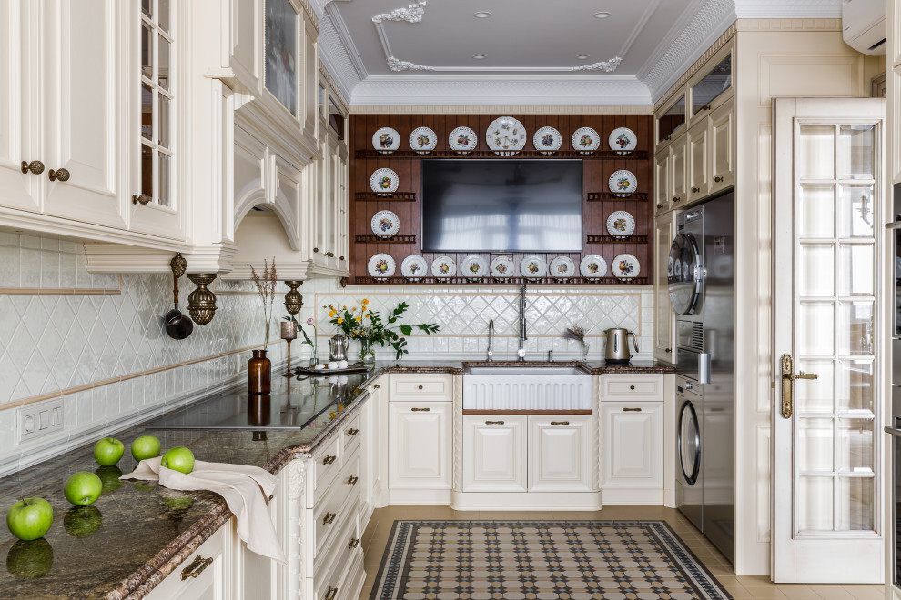 Inspiration for a large timeless galley ceramic tile and beige floor eat-in kitchen remodel in Other with a farmhouse sink, raised-panel cabinets, beige cabinets, granite countertops, beige backsplash, ceramic backsplash, stainless steel appliances and brown countertops