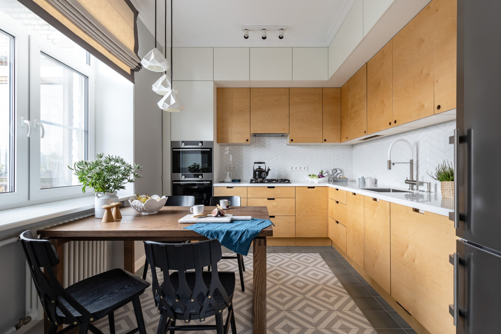 This is an example of a medium sized scandi l-shaped kitchen/diner in Saint Petersburg with flat-panel cabinets, yellow cabinets, composite countertops, white splashback, ceramic splashback, ceramic flooring, no island, grey floors and white worktops.