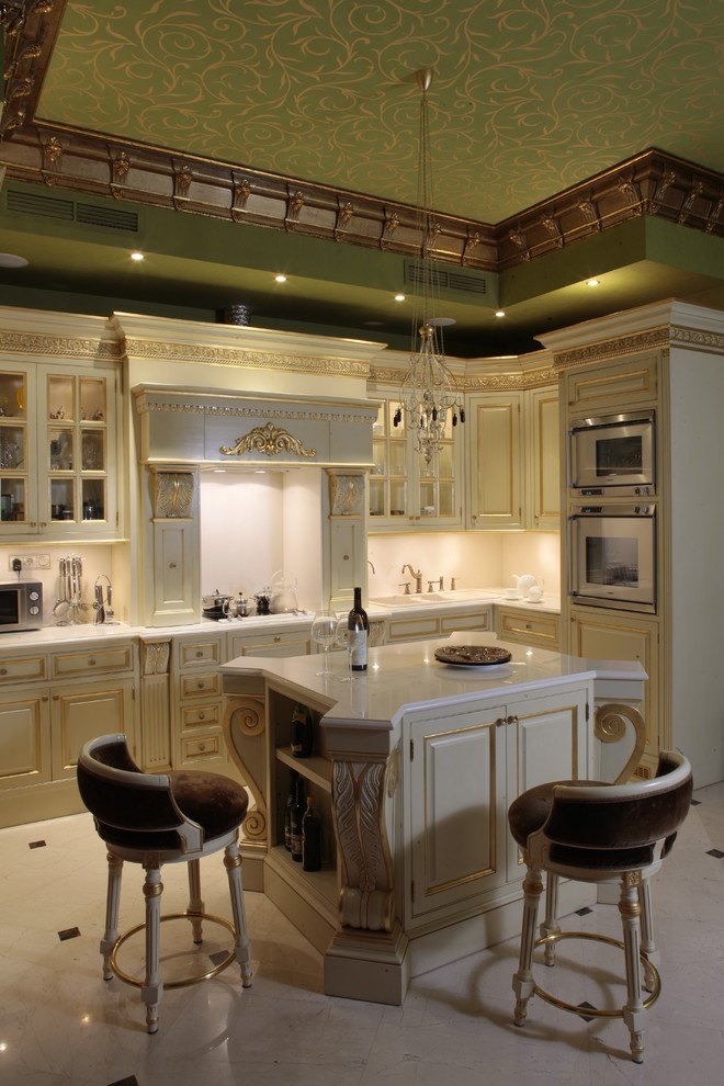 Design ideas for a traditional l-shaped kitchen in Moscow with raised-panel cabinets, beige cabinets and an island.