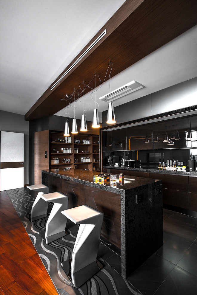 Contemporary single-wall open plan kitchen in Moscow with flat-panel cabinets, dark wood cabinets, black splashback, an island and black floors.