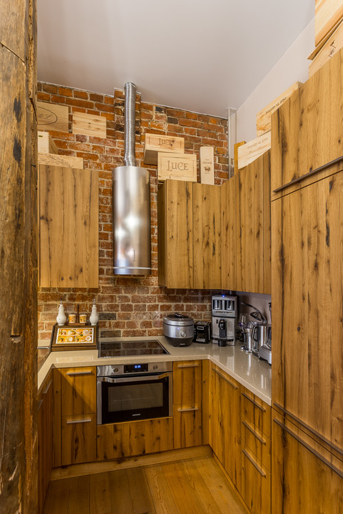 Rustic Kitchen Cabinets with All Natural Wood Cabinets and Brick Backsplash