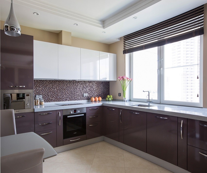 Trendy l-shaped kitchen photo in Moscow with an undermount sink, flat-panel cabinets, stainless steel appliances and no island