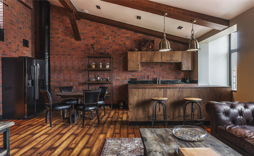 Cette image montre une cuisine urbaine en bois vieilli avec un placard à porte plane, un électroménager en acier inoxydable, un sol en bois brun et une péninsule.