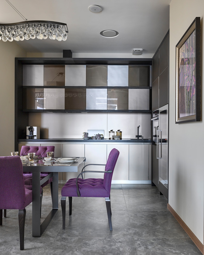 Photo of a contemporary grey and purple l-shaped kitchen/diner in Moscow with a submerged sink, flat-panel cabinets, grey cabinets, stainless steel appliances, grey floors, white splashback and no island.