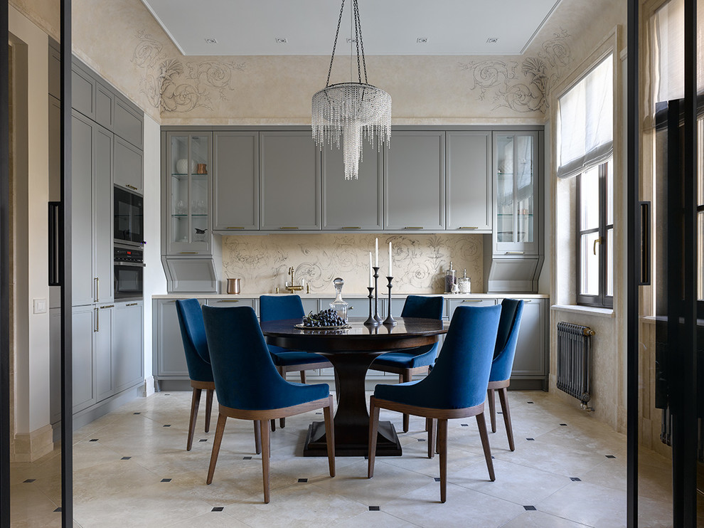 Example of a transitional l-shaped travertine floor and beige floor enclosed kitchen design in Moscow with recessed-panel cabinets, gray cabinets, beige backsplash, black appliances, no island and beige countertops