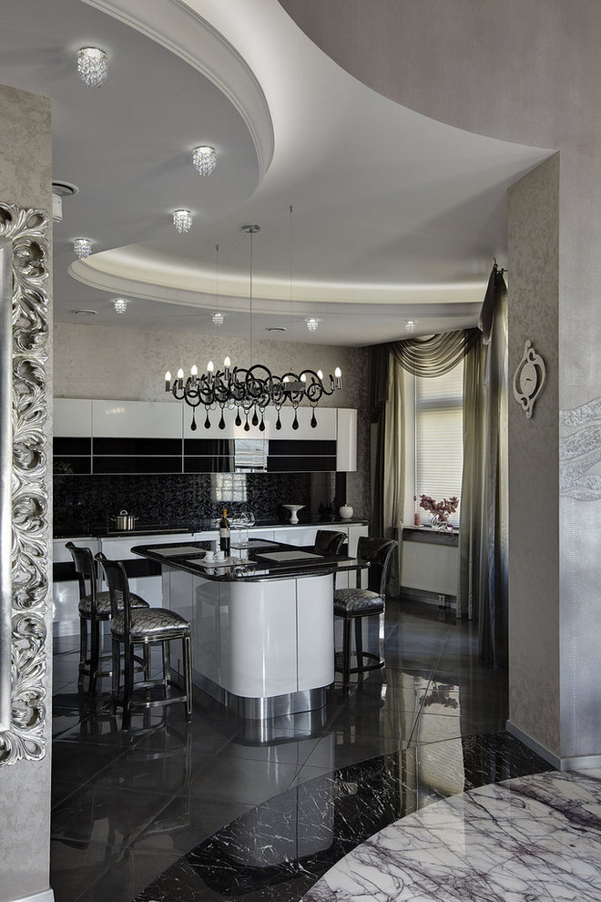 Immagine di una grande cucina minimal con ante lisce, top in granito, paraspruzzi nero, pavimento in gres porcellanato e pavimento grigio